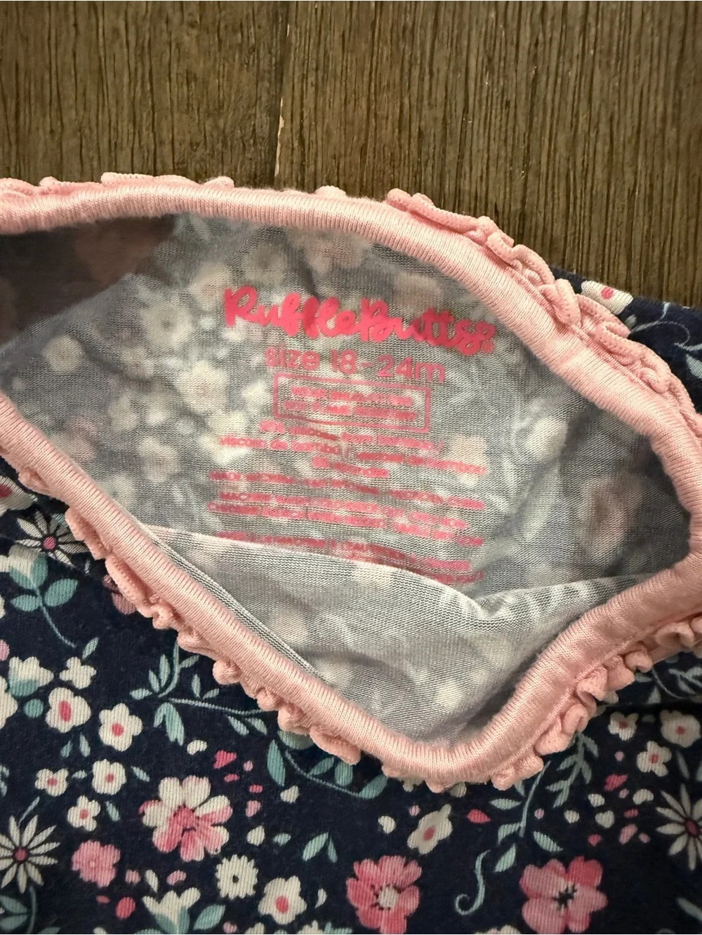 Ruffle Butts Navy Floral Top with Pink Trim